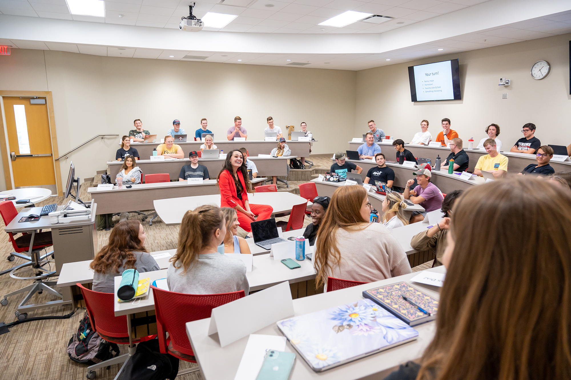 Graduate Assistant discussing work with students